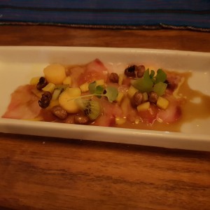 Sliced red snapper with fruits