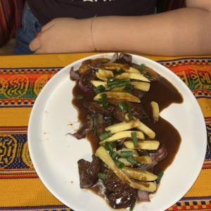 Lomito Salteado - Sauteed Steak with French fries and rice