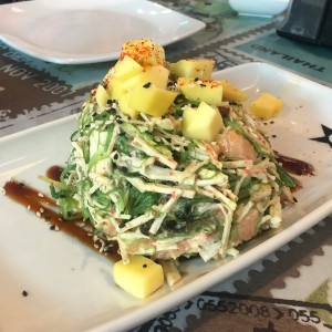 salad with salmon, seaweed, avocado and mango