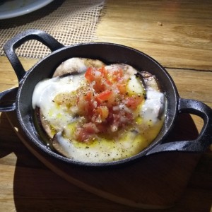 Hongos en queso fundido. 