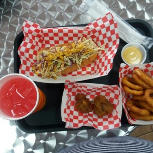 Jerk pork sandwhich, torrejitas, onion rings and pink lemonade