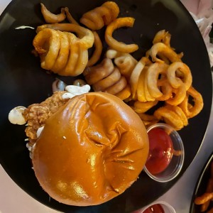Chicken burger with curly fries