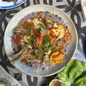 Guacho con guandú, coco y mariscos