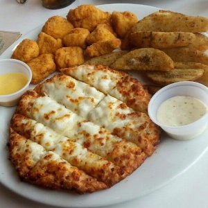 Chicken poppers, papas wedges, cheesesticks 