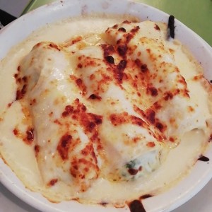 Canellonis rellenos de espinaca gratinados