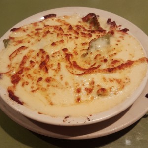 Raviolis de espinaca gratinados