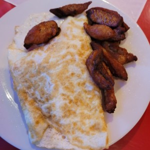 omelete huevo con puerco frito