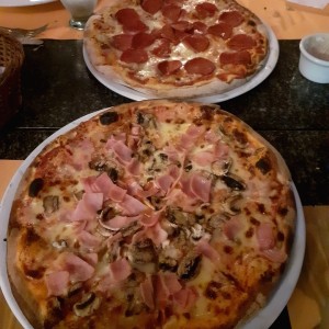 Pizza de prosciutto e funghi y pizza de pepperoni.
